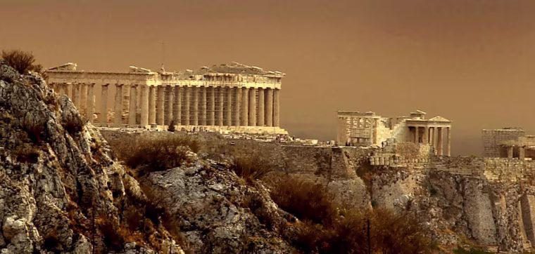 A brown haze settles over the Parthenon on the ancient Acropolis in center of Athens as smoke generated from a fire in the resort village of Agious Theodorous near the town of Corinth, about 64 kilometers (40 miles) west of Athens covered the Greek capital Thursday, July 13, 2000. Gale force winds fanned about 100 fires around the country, seriously hampering efforts to fight the blazes. (AP/EUROKINISSI)